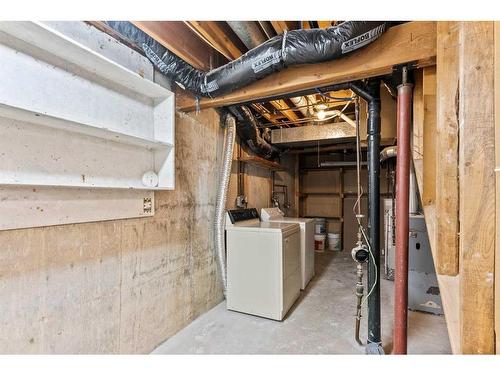 220 Queen Anne Place Se, Calgary, AB - Indoor Photo Showing Laundry Room