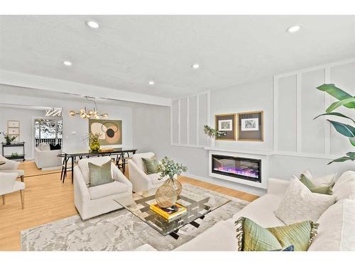 220 Queen Anne Place Se, Calgary, AB - Indoor Photo Showing Living Room With Fireplace