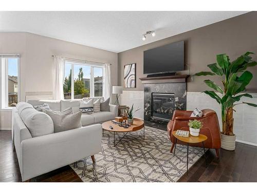 85 Silverado Skies Crescent Sw, Calgary, AB - Indoor Photo Showing Living Room With Fireplace