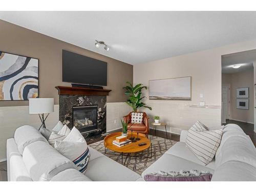 85 Silverado Skies Crescent Sw, Calgary, AB - Indoor Photo Showing Living Room With Fireplace