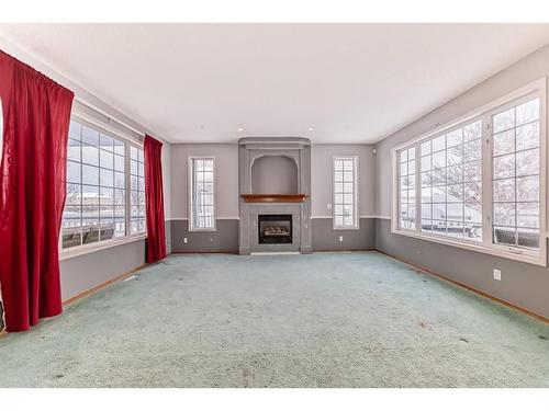 7 Wilson Road Ne, Langdon, AB - Indoor Photo Showing Living Room With Fireplace