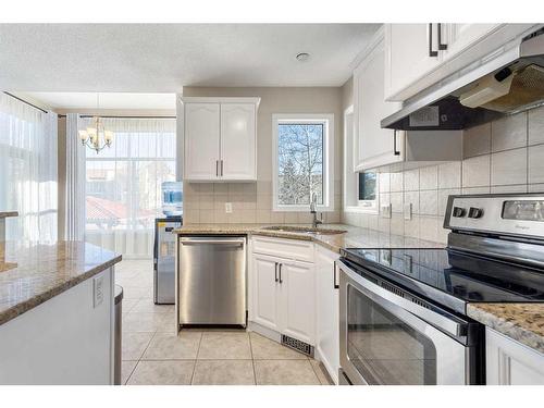 185 Simcoe Circle Sw, Calgary, AB - Indoor Photo Showing Kitchen With Stainless Steel Kitchen With Upgraded Kitchen