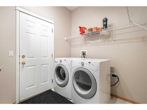 185 Simcoe Circle Sw, Calgary, AB - Indoor Photo Showing Laundry Room