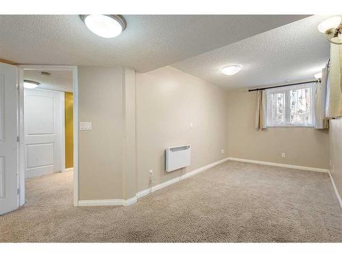 185 Simcoe Circle Sw, Calgary, AB - Indoor Photo Showing Other Room