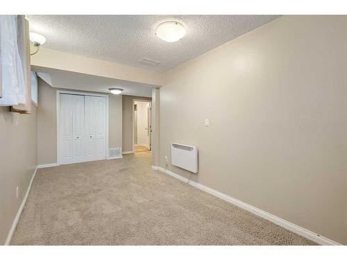 185 Simcoe Circle Sw, Calgary, AB - Indoor Photo Showing Other Room