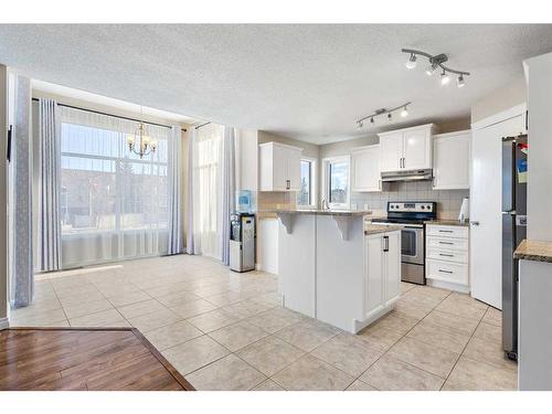 185 Simcoe Circle Sw, Calgary, AB - Indoor Photo Showing Kitchen With Stainless Steel Kitchen