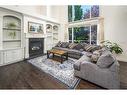 15 Canso Green Sw, Calgary, AB  - Indoor Photo Showing Living Room With Fireplace 