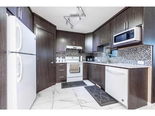 23 Saddlemont Way Ne, Calgary, AB - Indoor Photo Showing Kitchen