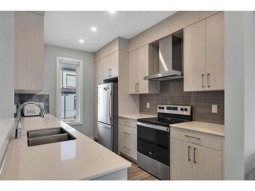 326 Evanscrest Square Nw, Calgary, AB - Indoor Photo Showing Kitchen With Stainless Steel Kitchen With Double Sink With Upgraded Kitchen