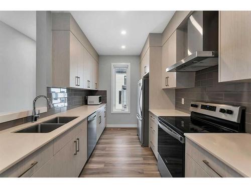 326 Evanscrest Square Nw, Calgary, AB - Indoor Photo Showing Kitchen With Stainless Steel Kitchen With Double Sink