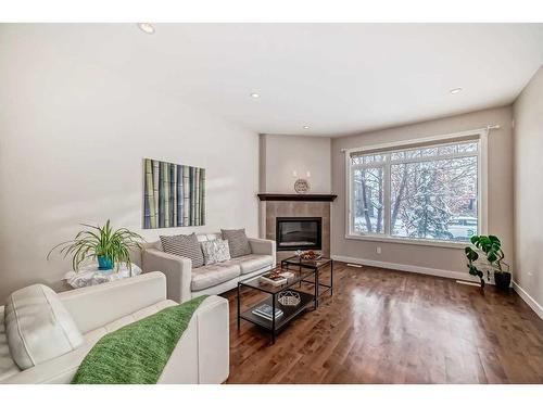 2416 1 Avenue Nw, Calgary, AB - Indoor Photo Showing Living Room With Fireplace