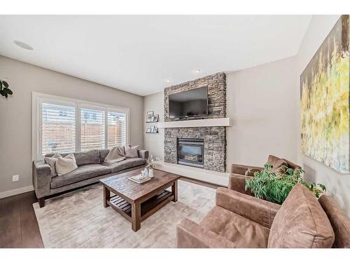 54 Copperpond Heath Se, Calgary, AB - Indoor Photo Showing Living Room With Fireplace