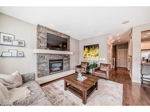 54 Copperpond Heath Se, Calgary, AB - Indoor Photo Showing Living Room With Fireplace