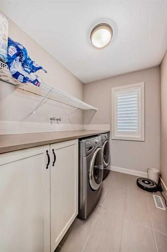 54 Copperpond Heath Se, Calgary, AB - Indoor Photo Showing Laundry Room