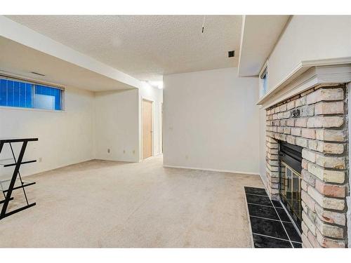 240 Falton Drive Ne, Calgary, AB - Indoor With Fireplace