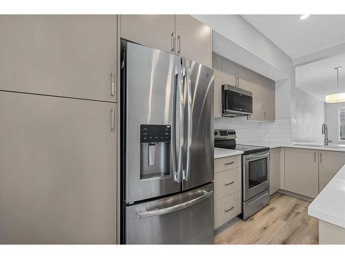 230 South Point Park Sw, Airdrie, AB - Indoor Photo Showing Kitchen With Stainless Steel Kitchen With Upgraded Kitchen