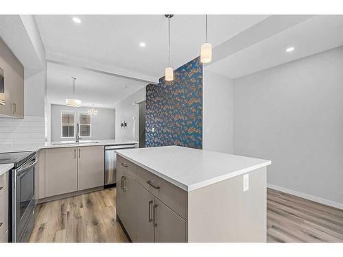 230 South Point Park Sw, Airdrie, AB - Indoor Photo Showing Kitchen With Upgraded Kitchen