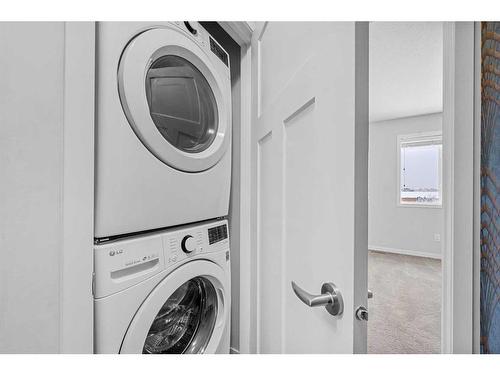 230 South Point Park Sw, Airdrie, AB - Indoor Photo Showing Laundry Room