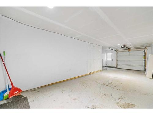 230 South Point Park Sw, Airdrie, AB - Indoor Photo Showing Garage