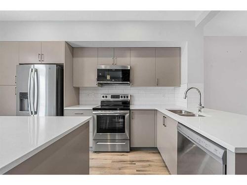 230 South Point Park Sw, Airdrie, AB - Indoor Photo Showing Kitchen With Stainless Steel Kitchen With Double Sink With Upgraded Kitchen