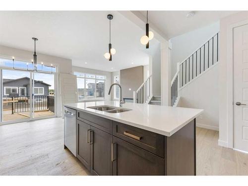 156 Sundown Crescent, Cochrane, AB - Indoor Photo Showing Kitchen With Double Sink With Upgraded Kitchen