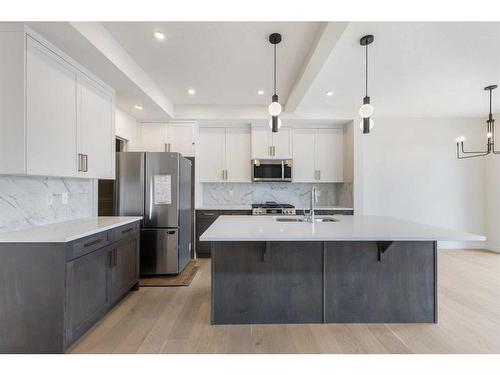 156 Sundown Crescent, Cochrane, AB - Indoor Photo Showing Kitchen With Double Sink With Upgraded Kitchen