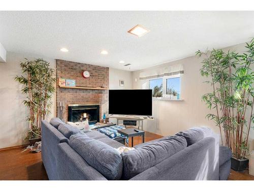 312 Silverthorn Way Nw, Calgary, AB - Indoor Photo Showing Other Room With Fireplace