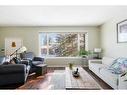 312 Silverthorn Way Nw, Calgary, AB  - Indoor Photo Showing Living Room 