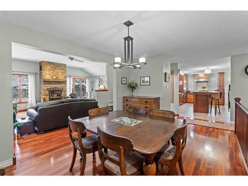 2917 Lathom Crescent Sw, Calgary, AB - Indoor Photo Showing Dining Room With Fireplace