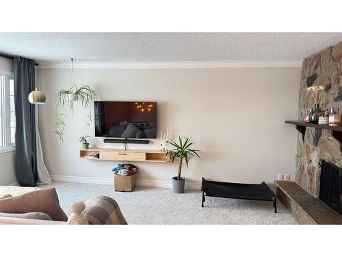 5015 Centre A Street Ne, Calgary, AB - Indoor Photo Showing Living Room With Fireplace