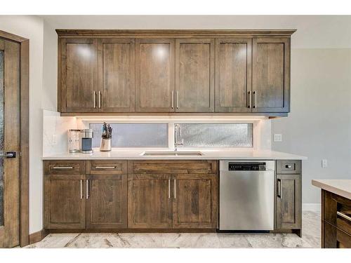 42 Woodhaven Crescent Sw, Calgary, AB - Indoor Photo Showing Kitchen With Double Sink