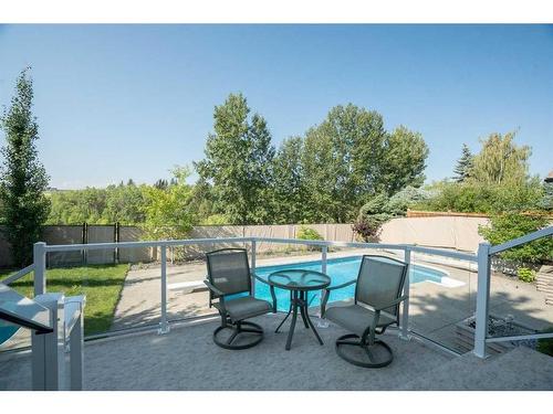 42 Woodhaven Crescent Sw, Calgary, AB - Outdoor With In Ground Pool With Backyard