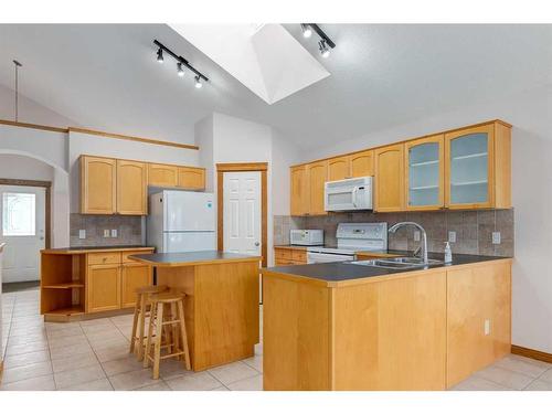 162 Rocky Ridge Circle Nw, Calgary, AB - Indoor Photo Showing Kitchen With Double Sink