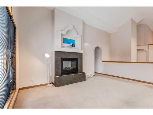 162 Rocky Ridge Circle Nw, Calgary, AB - Indoor Photo Showing Living Room With Fireplace