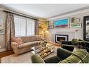 4225 5A Street Sw, Calgary, AB  - Indoor Photo Showing Living Room With Fireplace 