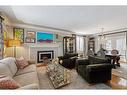 4225 5A Street Sw, Calgary, AB  - Indoor Photo Showing Living Room With Fireplace 