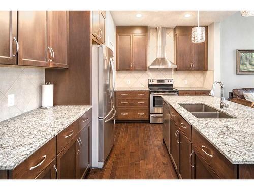 11 Evansview Road Nw, Calgary, AB - Indoor Photo Showing Kitchen With Stainless Steel Kitchen With Double Sink With Upgraded Kitchen