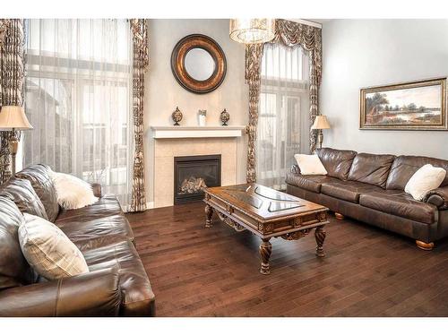 11 Evansview Road Nw, Calgary, AB - Indoor Photo Showing Living Room With Fireplace