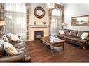 11 Evansview Road Nw, Calgary, AB  - Indoor Photo Showing Living Room With Fireplace 