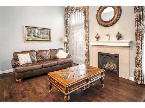 11 Evansview Road Nw, Calgary, AB - Indoor Photo Showing Living Room With Fireplace