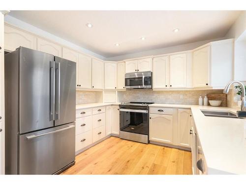 52 Sundown Way Se, Calgary, AB - Indoor Photo Showing Kitchen With Double Sink