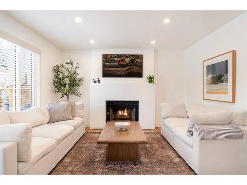 52 Sundown Way Se, Calgary, AB - Indoor Photo Showing Living Room With Fireplace