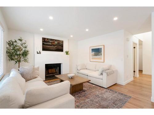 52 Sundown Way Se, Calgary, AB - Indoor Photo Showing Living Room With Fireplace