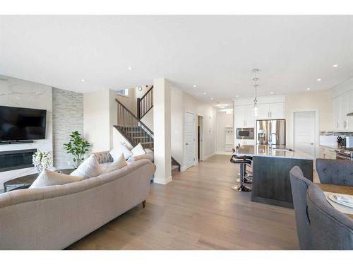 185 Carringvue Manor Nw, Calgary, AB - Indoor Photo Showing Living Room With Fireplace