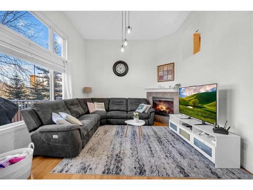 22 Dover Mews Se, Calgary, AB - Indoor Photo Showing Living Room With Fireplace