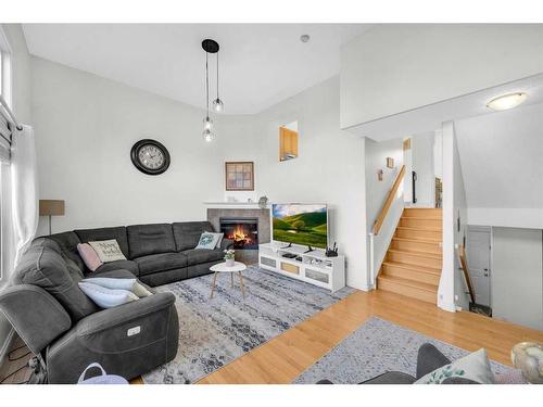 22 Dover Mews Se, Calgary, AB - Indoor Photo Showing Living Room With Fireplace