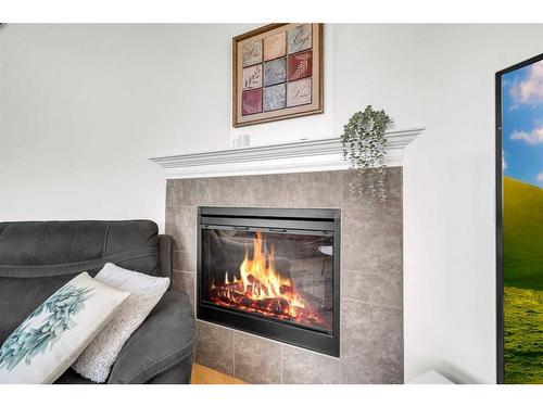 22 Dover Mews Se, Calgary, AB - Indoor Photo Showing Living Room With Fireplace