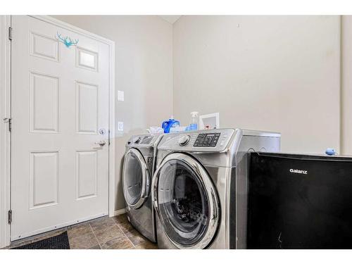 146 Bridlerange Place Sw, Calgary, AB - Indoor Photo Showing Laundry Room