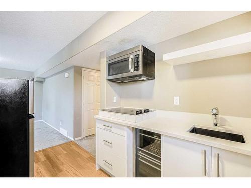 146 Bridlerange Place Sw, Calgary, AB - Indoor Photo Showing Kitchen