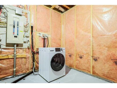 146 Bridlerange Place Sw, Calgary, AB - Indoor Photo Showing Laundry Room